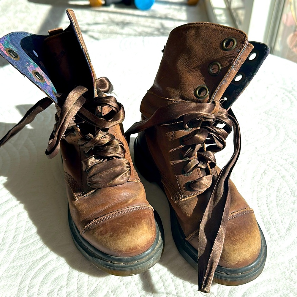 Dr. Martens raced-up combat boots with ribbon, pretty floral pattern inside